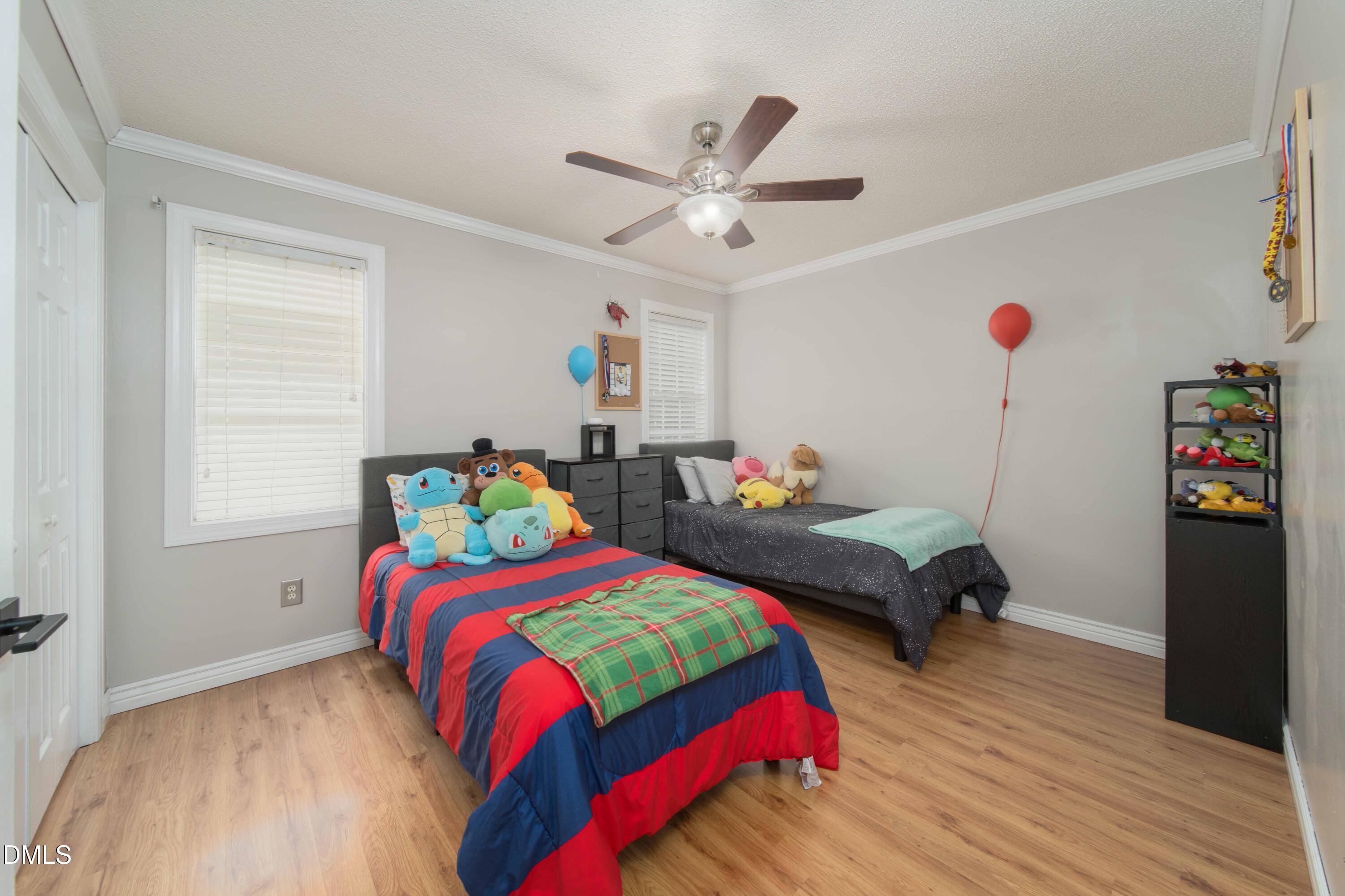 4411 Lessie Trail Rocky Mount, NC 27804 - Photo 14 of 27 a bedroom with bed and a window