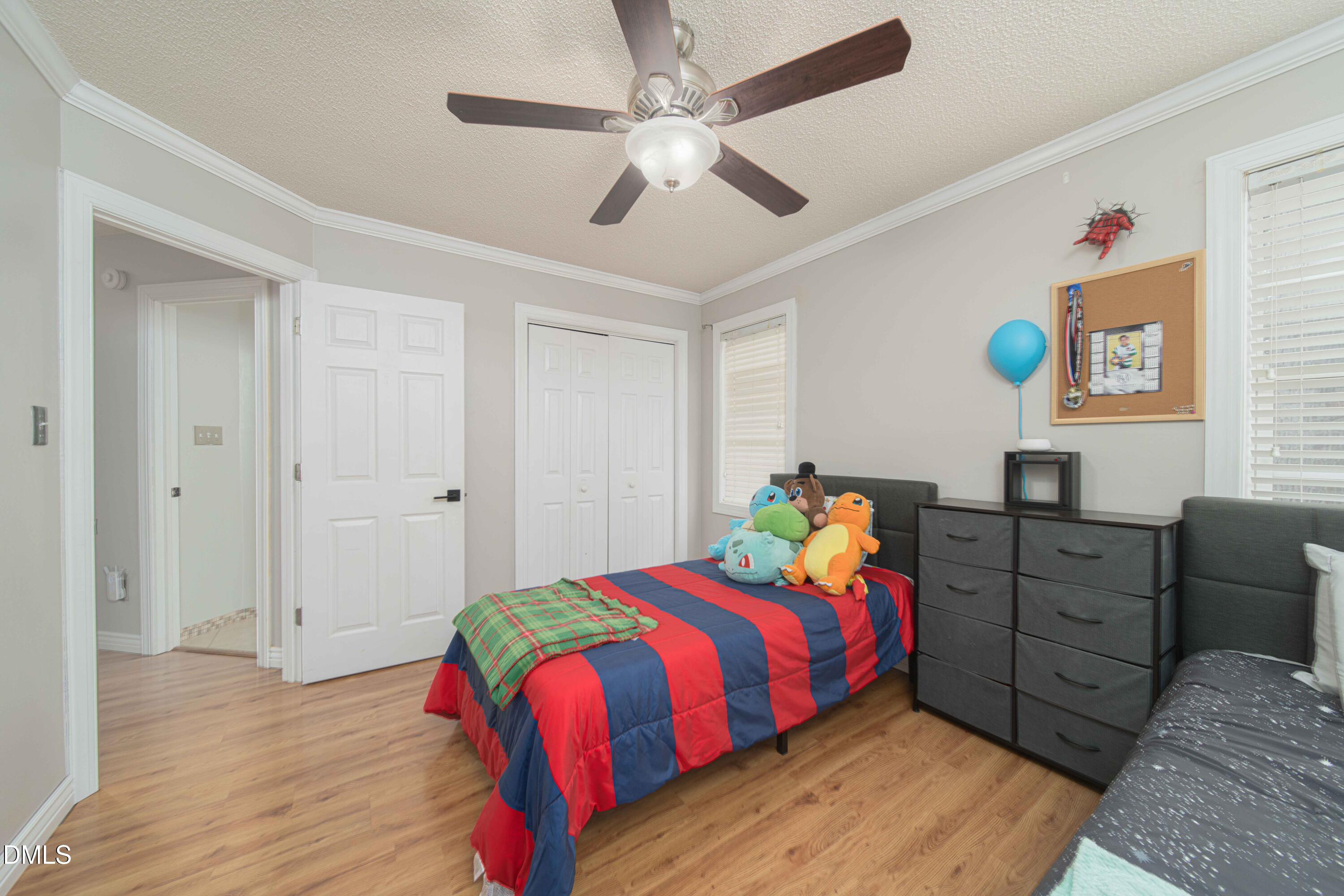 4411 Lessie Trail Rocky Mount, NC 27804 - Photo 15 of 27 a bedroom with a bed and a dresser