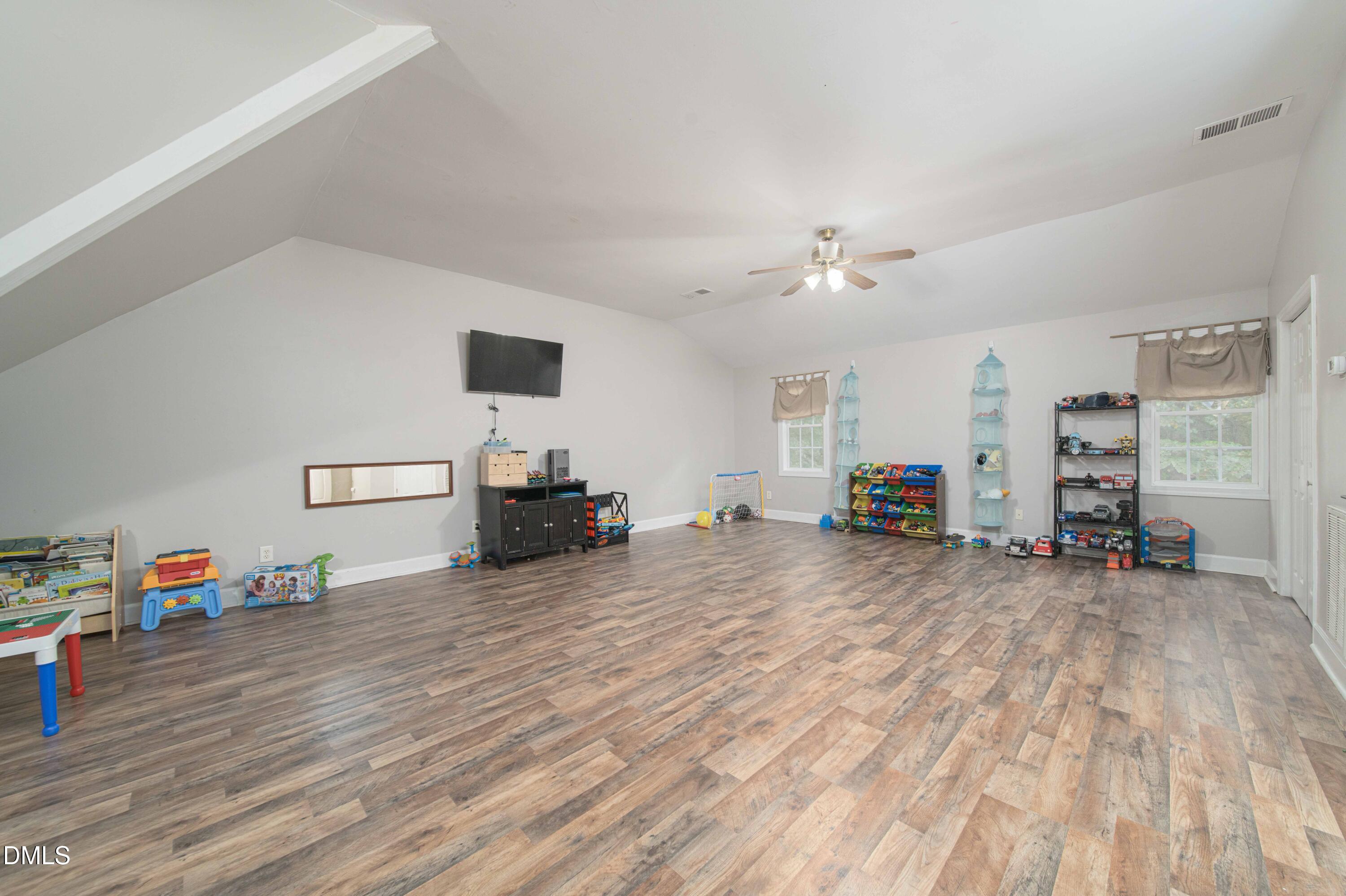 4411 Lessie Trail Rocky Mount, NC 27804 - Photo 19 of 27 a view of a livingroom with furniture and a flat screen tv