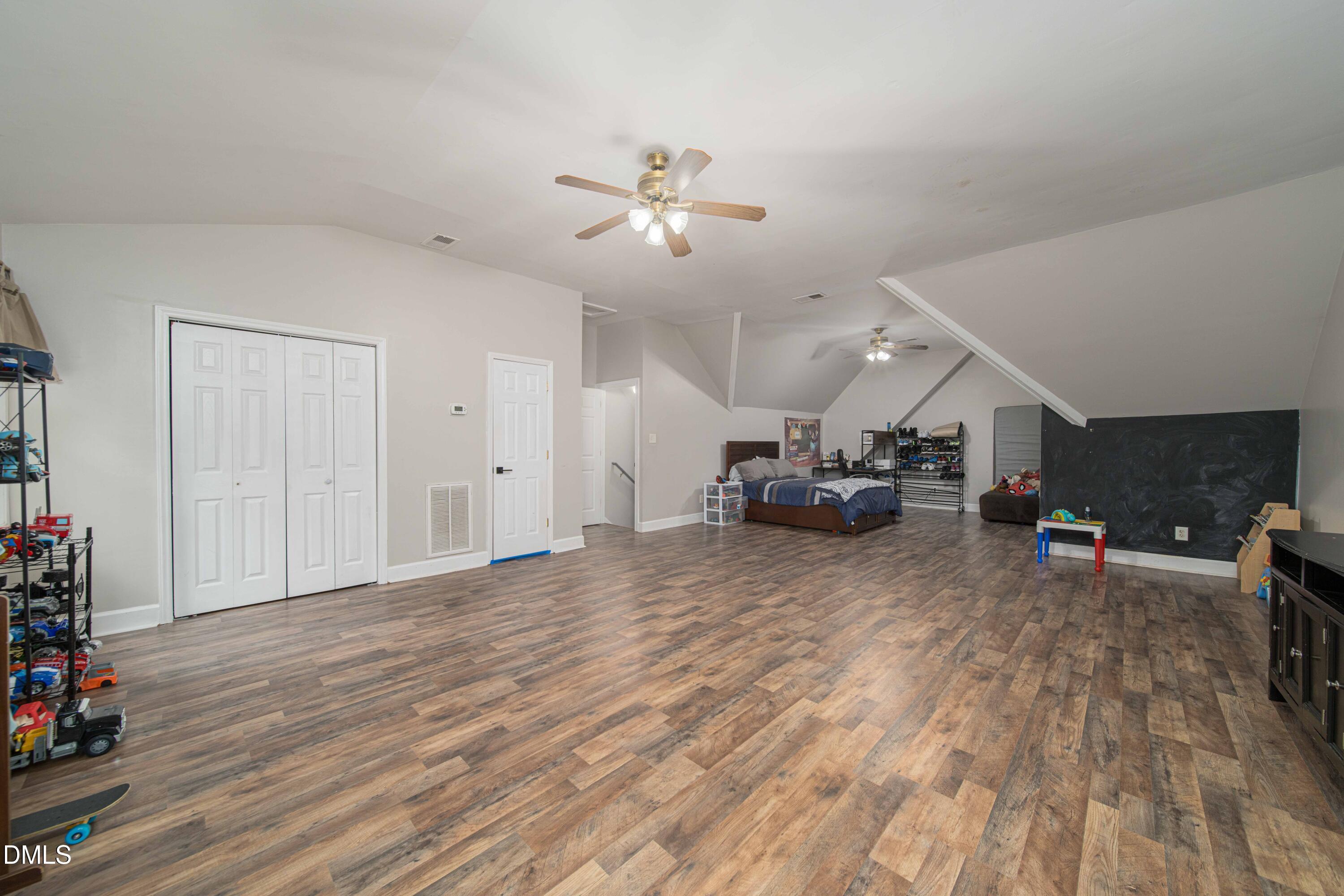 4411 Lessie Trail Rocky Mount, NC 27804 - Photo 22 of 27 a living room with furniture and a wooden floor