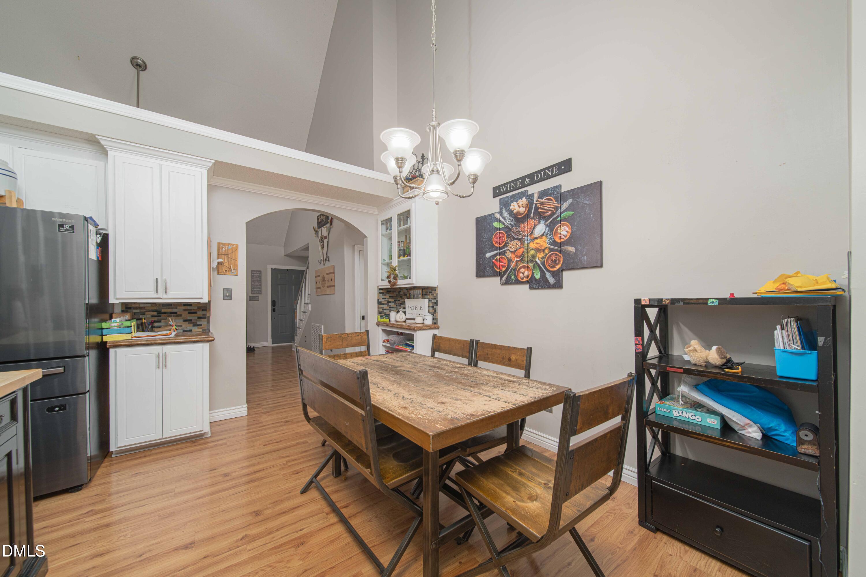 4411 Lessie Trail Rocky Mount, NC 27804 - Photo 9 of 27 a view of a dining room with furniture and chandelier