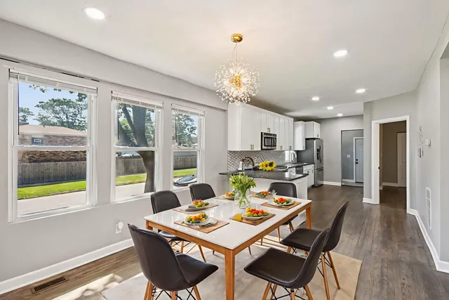 a view of a dining room with furniture window and outside view