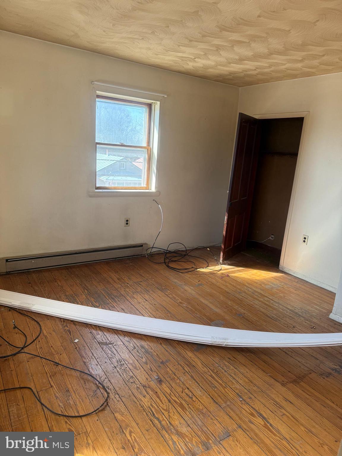 122 West 4th Avenue Ranson, WV 25438 - Photo 6 of 9 a view of a room with wooden floor