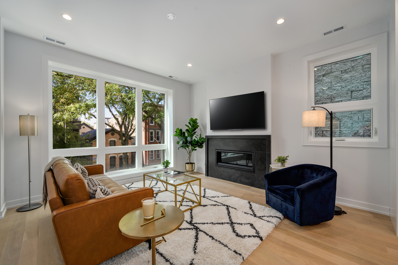 867 North Marshfield Avenue, Unit 2 Chicago, IL 60622 - Photo 3 of 19 a living room with fireplace furniture and a flat screen tv