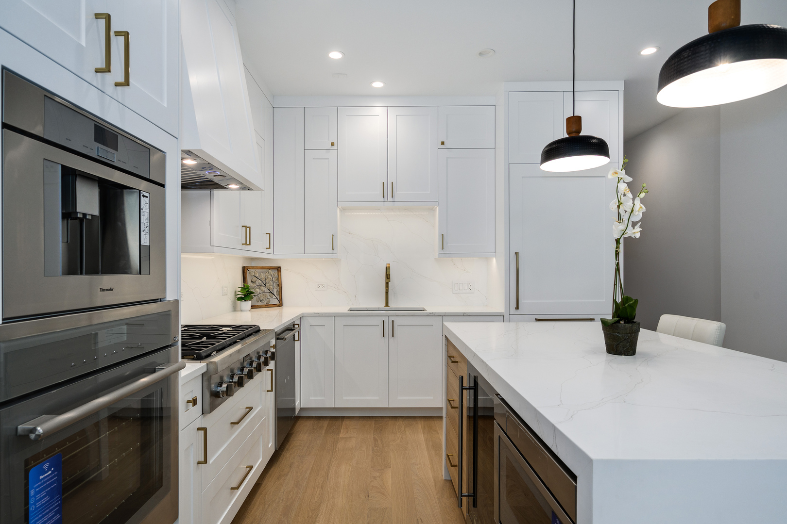 867 North Marshfield Avenue, Unit 2 Chicago, IL 60622 - Photo 6 of 19 a kitchen with granite countertop a sink stainless steel appliances and cabinets