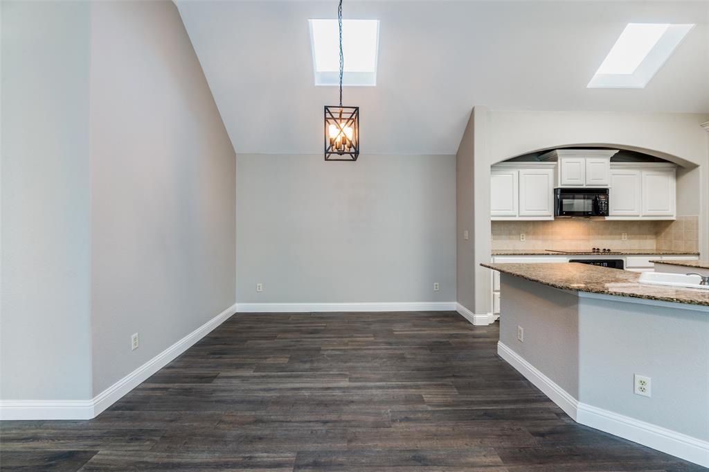 3230 Adirondack Lane Frisco, TX 75033 - Photo 11 of 27 a view of kitchen with granite countertop cabinets and wooden floor