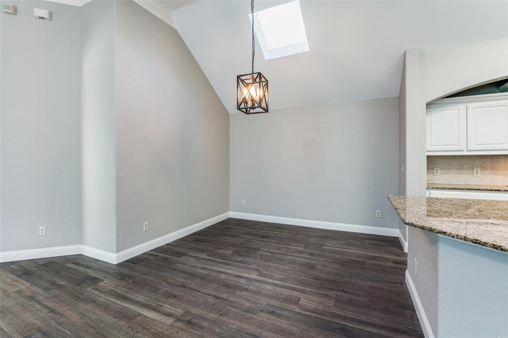 3230 Adirondack Lane Frisco, TX 75033 - Photo 12 of 27 a view of an empty room with wooden floor and a window