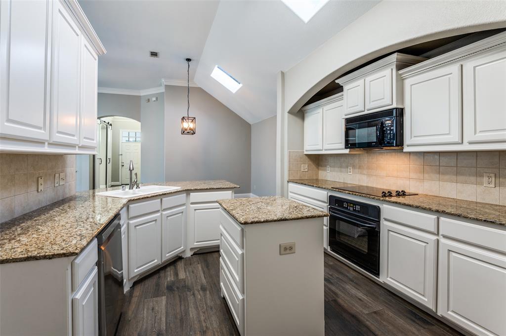 3230 Adirondack Lane Frisco, TX 75033 - Photo 15 of 27 a kitchen with granite countertop cabinets stainless steel appliances and a sink
