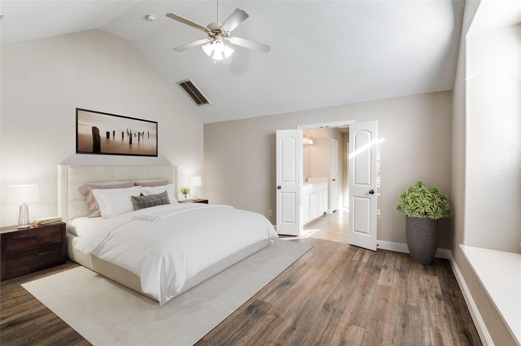 3230 Adirondack Lane Frisco, TX 75033 - Photo 16 of 27 a bedroom with a large bed and a chandelier