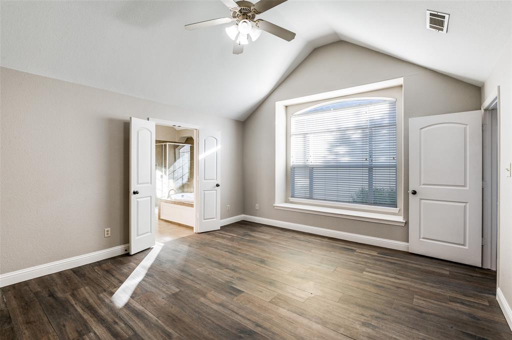 3230 Adirondack Lane Frisco, TX 75033 - Photo 17 of 27 a view of an empty room with a window and wooden floor