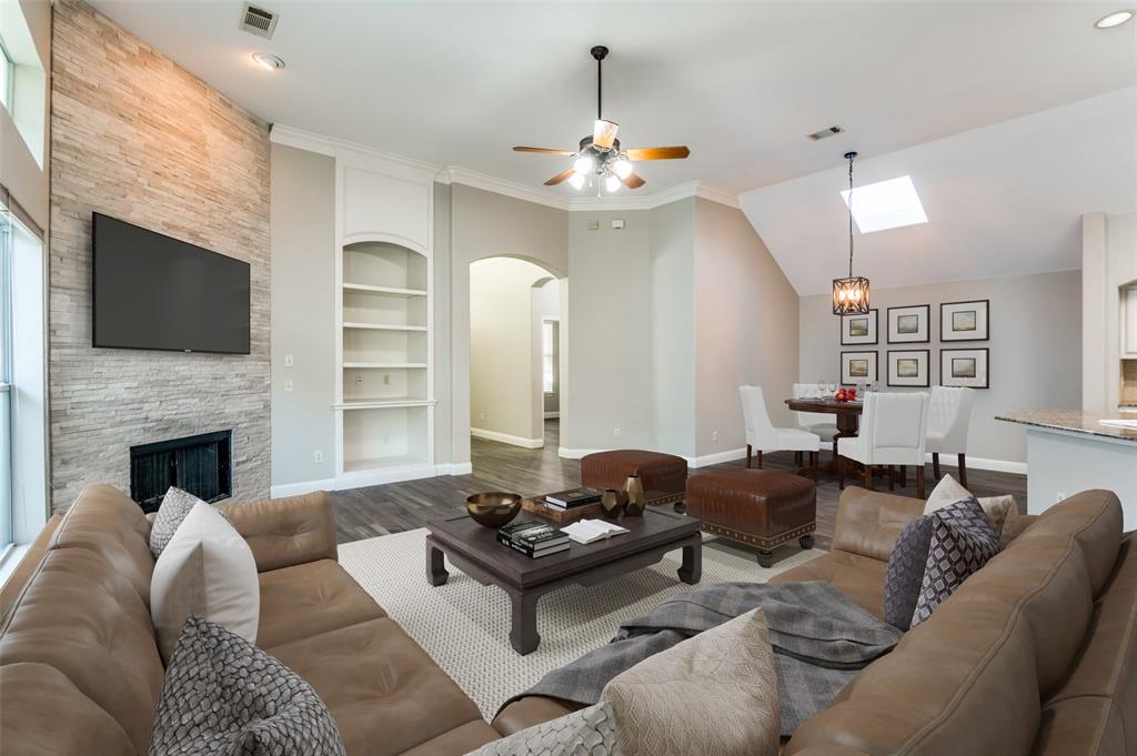 3230 Adirondack Lane Frisco, TX 75033 - Photo 2 of 27 a living room with furniture fireplace and flat screen tv