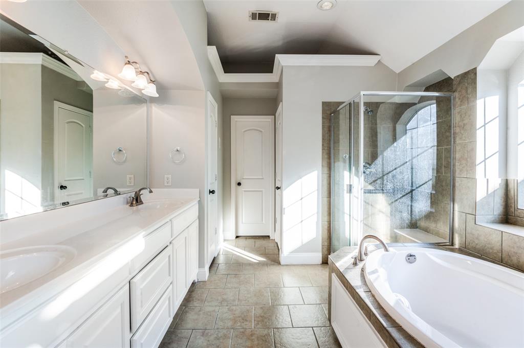 3230 Adirondack Lane Frisco, TX 75033 - Photo 21 of 27 a spacious bathroom with a tub sink and mirror