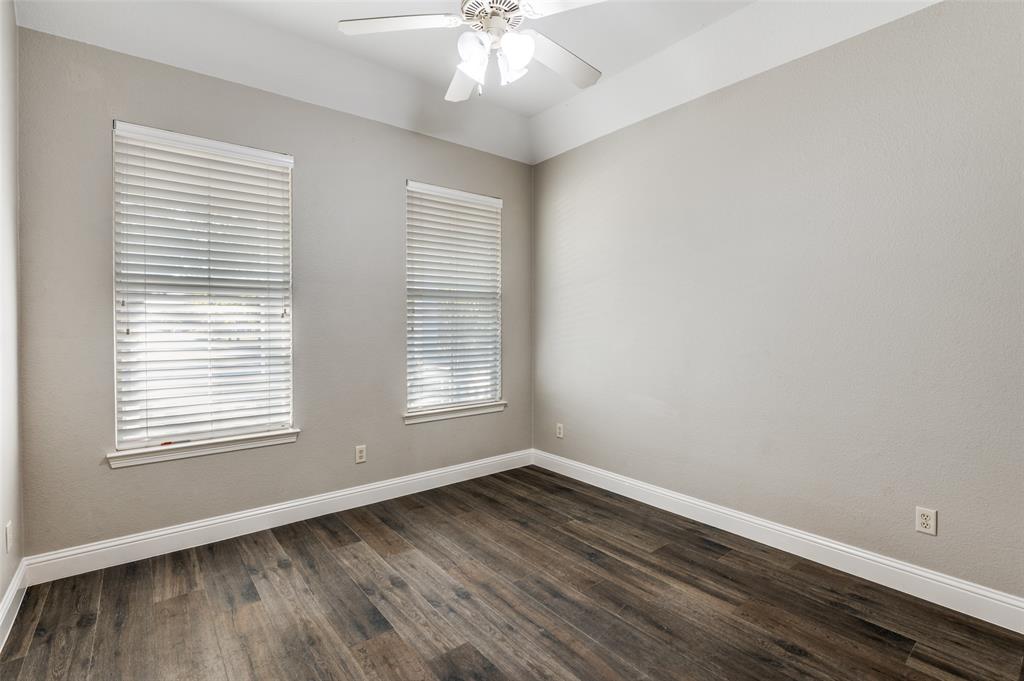 3230 Adirondack Lane Frisco, TX 75033 - Photo 23 of 27 an empty room with wooden floor and windows