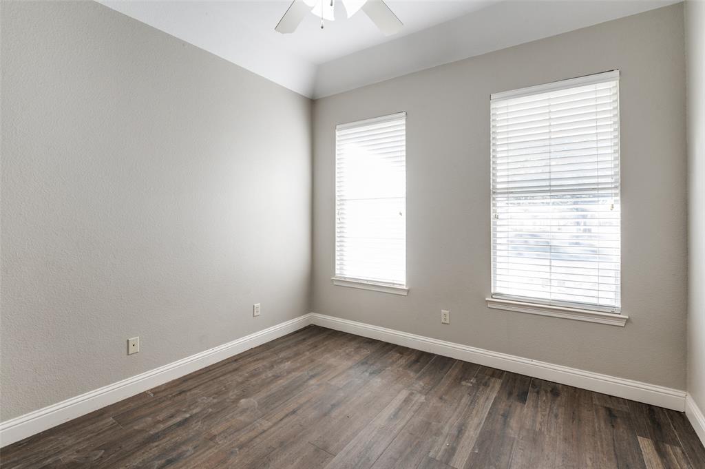 3230 Adirondack Lane Frisco, TX 75033 - Photo 24 of 27 an empty room with wooden floor and windows