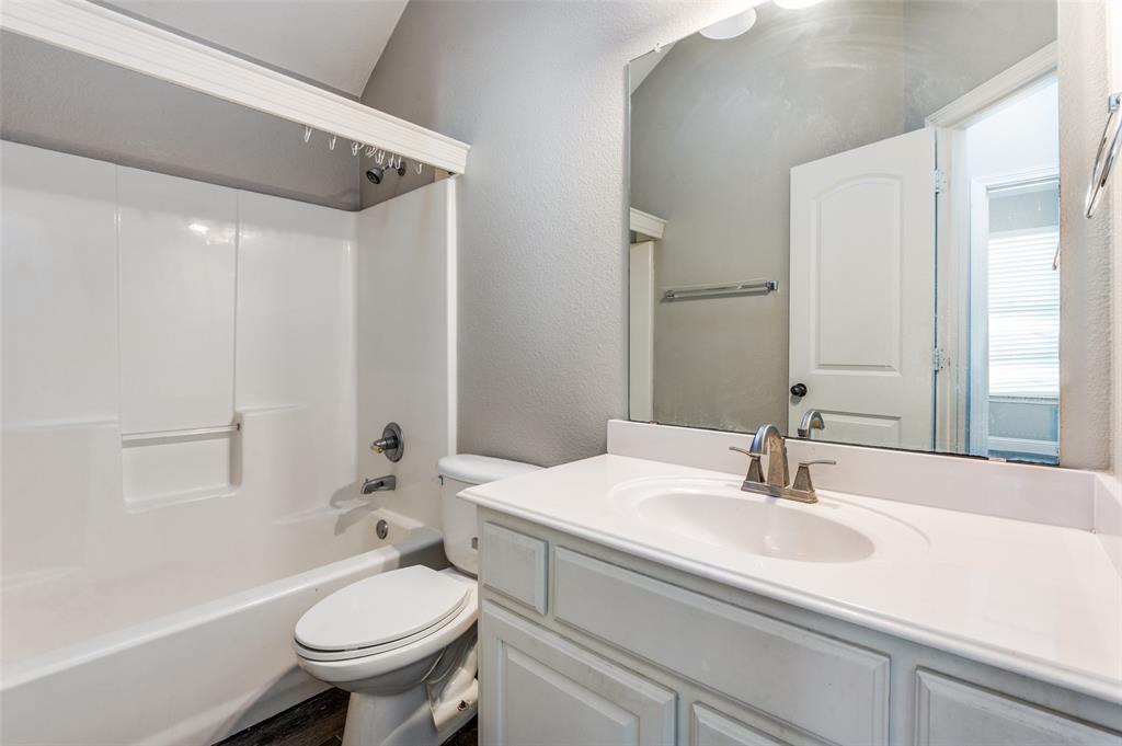 3230 Adirondack Lane Frisco, TX 75033 - Photo 25 of 27 a bathroom with a sink toilet and shower