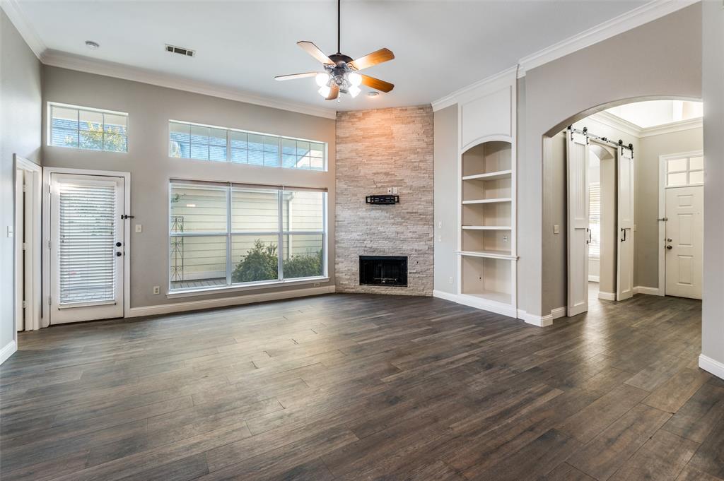 3230 Adirondack Lane Frisco, TX 75033 - Photo 4 of 27 a view of an empty room with a window and wooden floor
