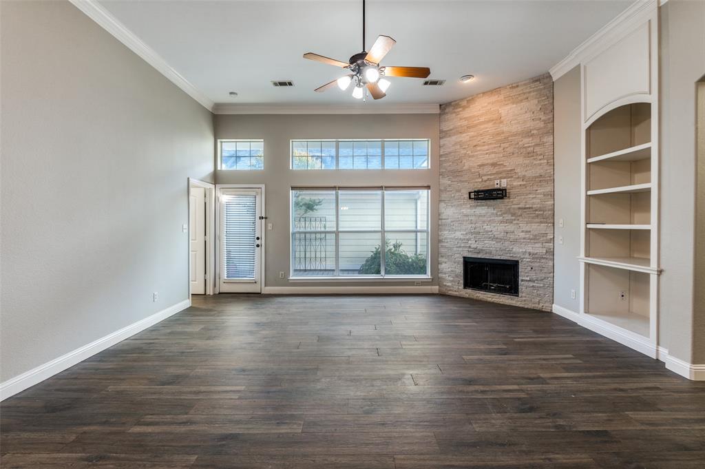 3230 Adirondack Lane Frisco, TX 75033 - Photo 7 of 27 a view of an empty room with a window and fireplace