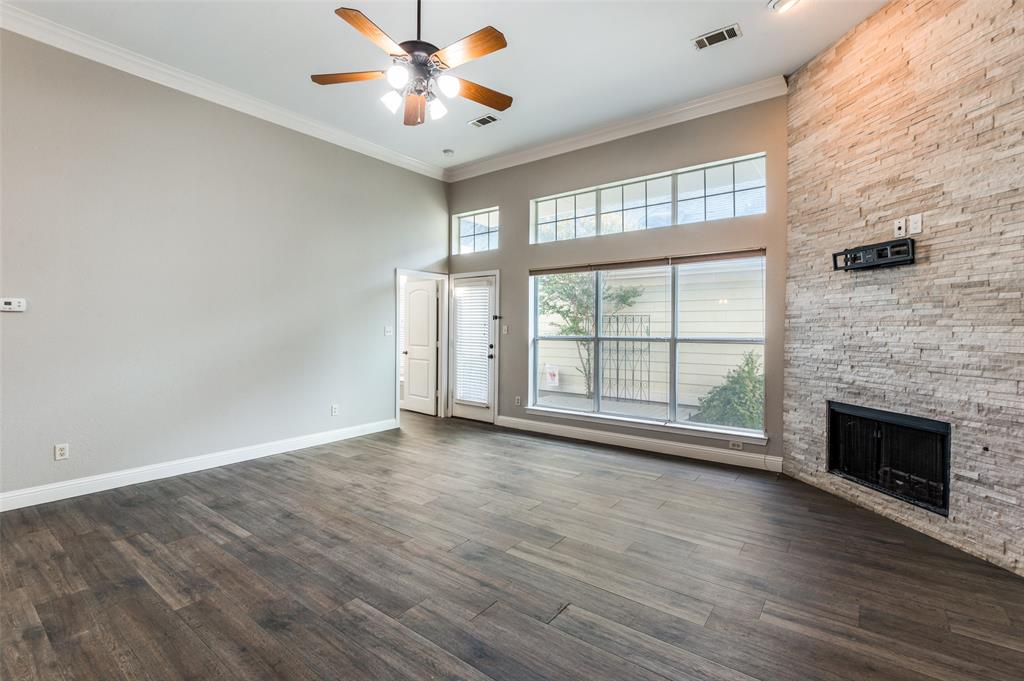 3230 Adirondack Lane Frisco, TX 75033 - Photo 8 of 27 a view of an empty room with a window and wooden floor