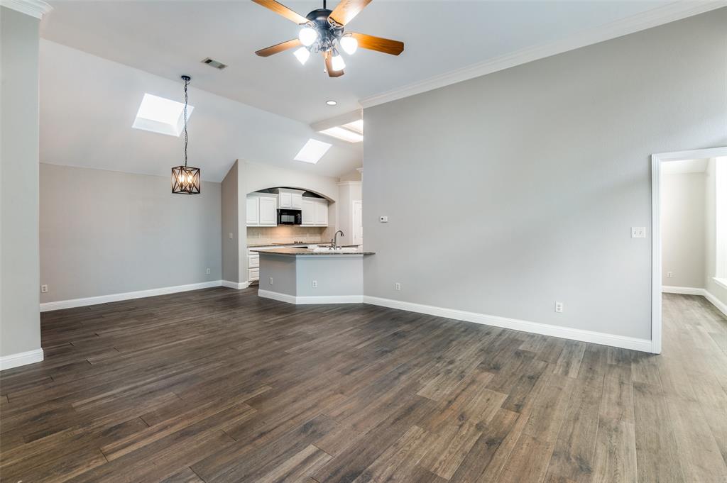 3230 Adirondack Lane Frisco, TX 75033 - Photo 9 of 27 wooden floor in an empty room with a window