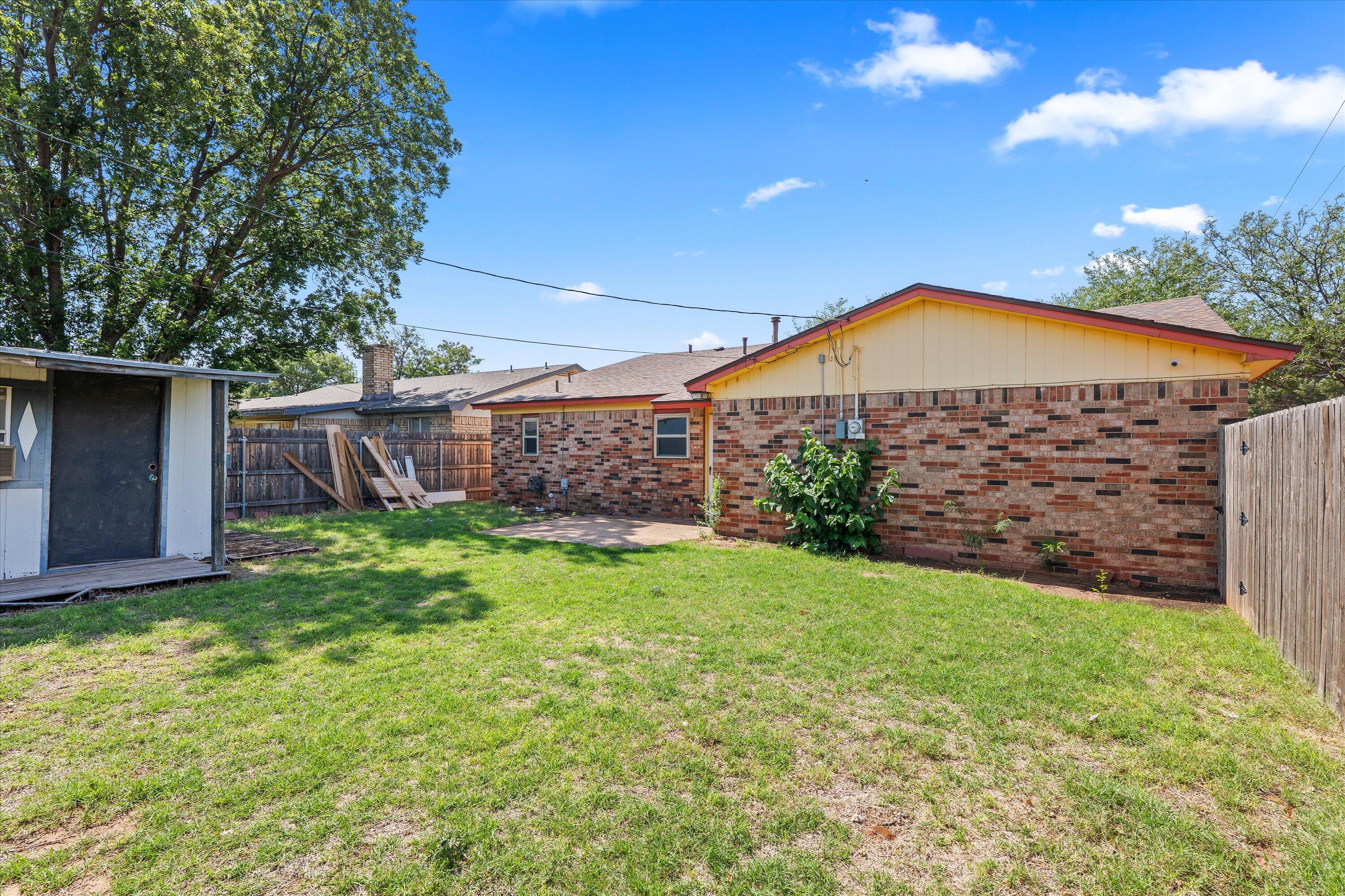 4520 54th Street Lubbock, TX 79414 - Photo 28 of 32 a view of a house with a yard