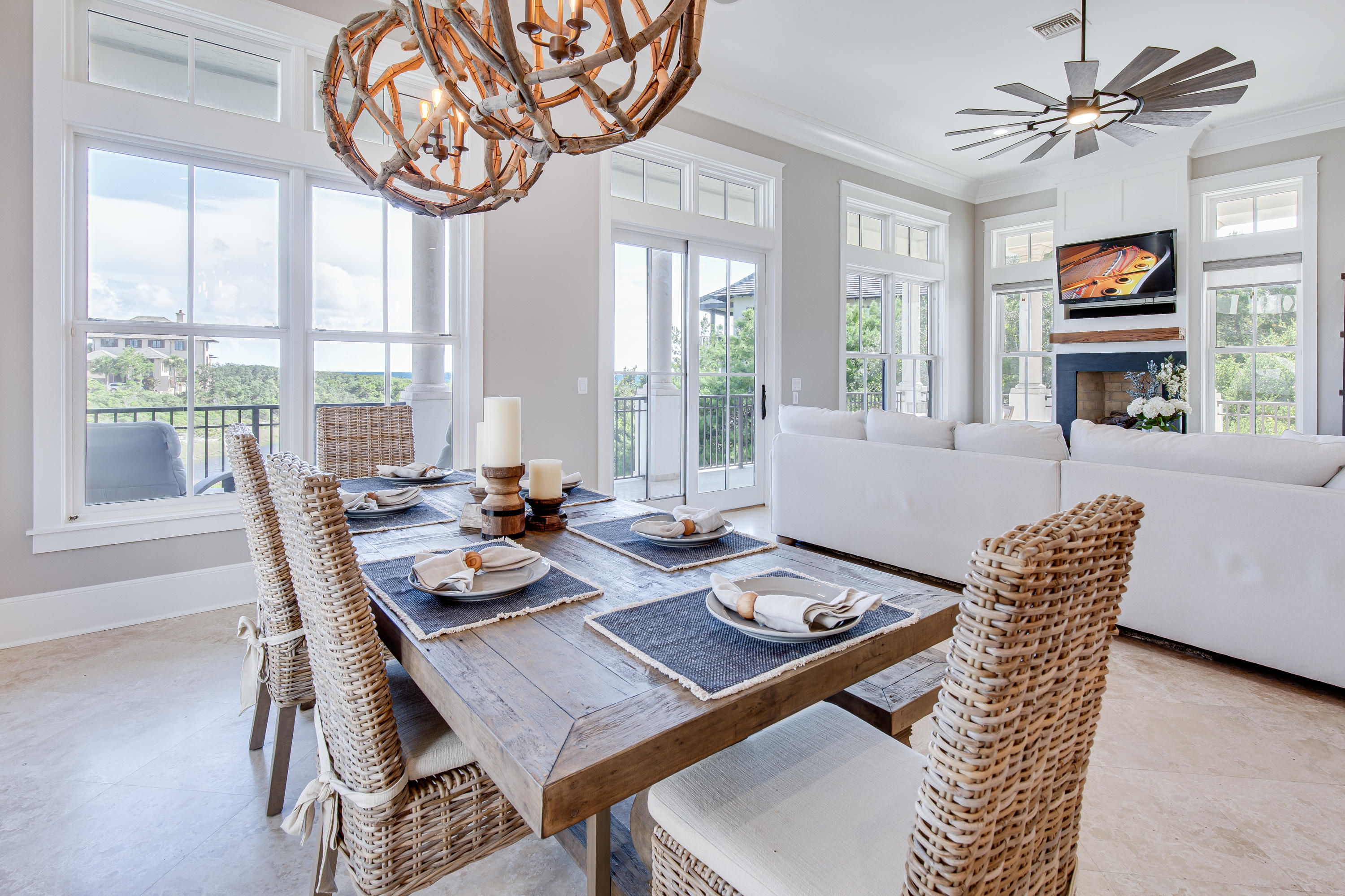 201 West Bermuda Drive Santa Rosa Beach, FL 32459 - Photo 15 of 56 a dining room with furniture a rug and a large window