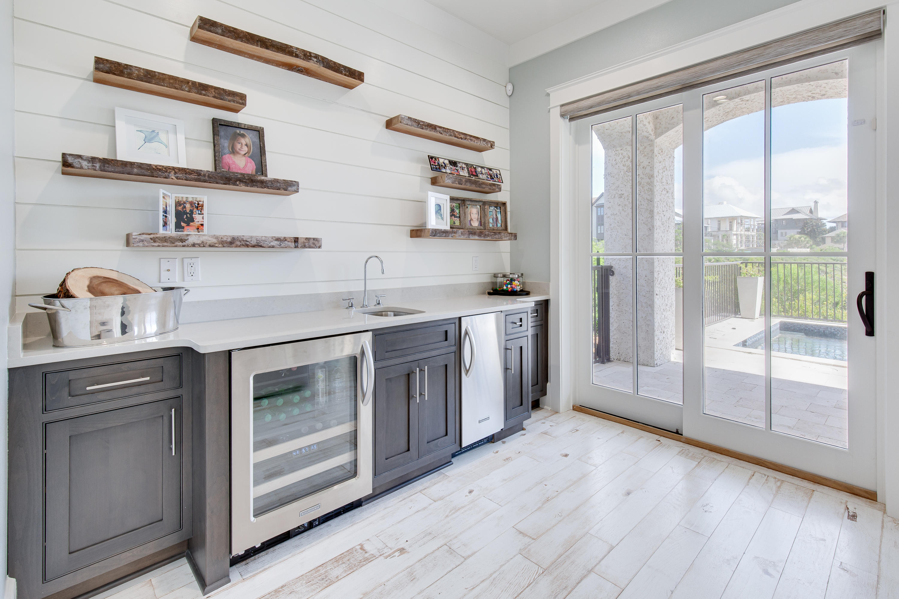 201 West Bermuda Drive Santa Rosa Beach, FL 32459 - Photo 23 of 56 a kitchen with stainless steel appliances granite countertop a stove a sink and a refrigerator with wooden floors