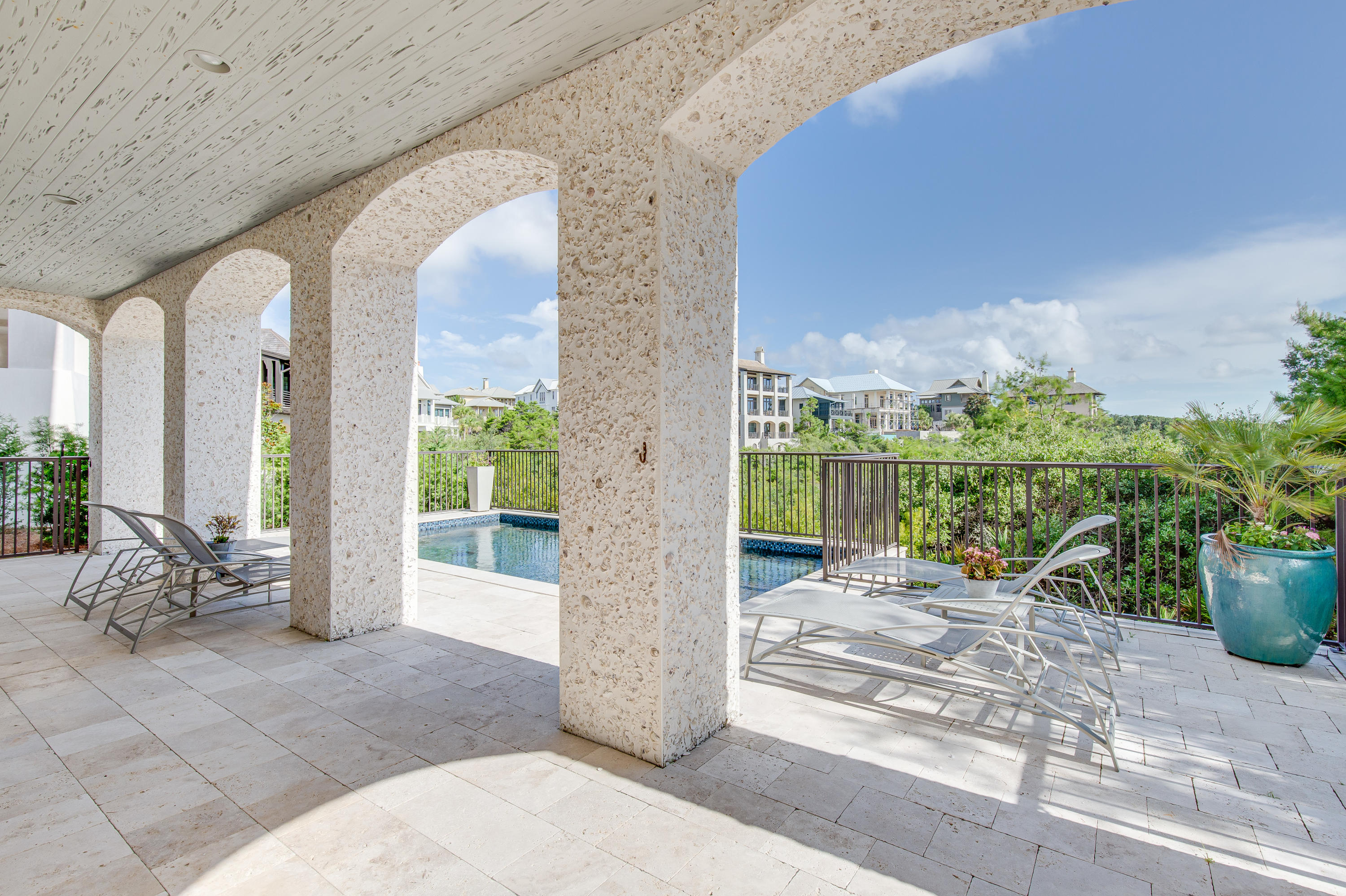 201 West Bermuda Drive Santa Rosa Beach, FL 32459 - Photo 25 of 56 a view of a porch with furniture and floor to ceiling window