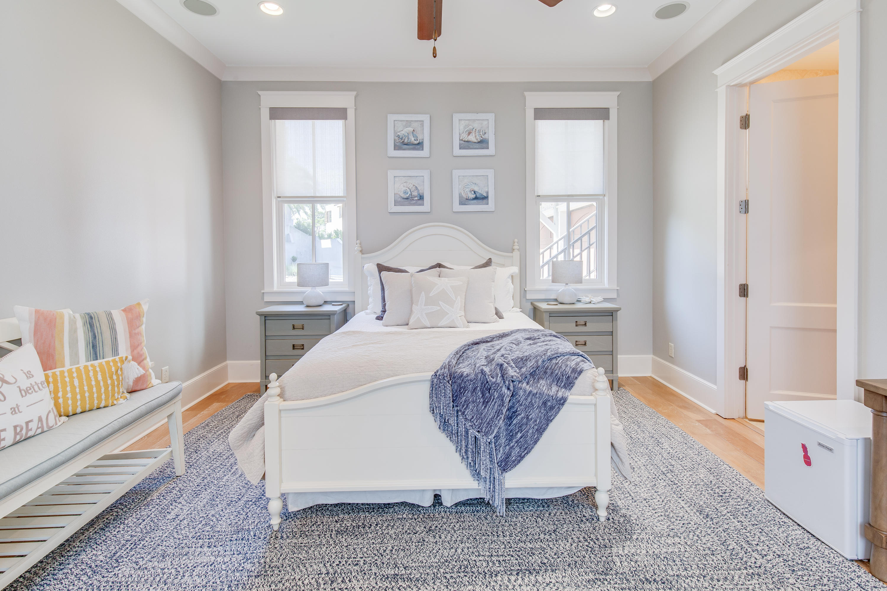 201 West Bermuda Drive Santa Rosa Beach, FL 32459 - Photo 28 of 56 a spacious bedroom with a bed a table and chair