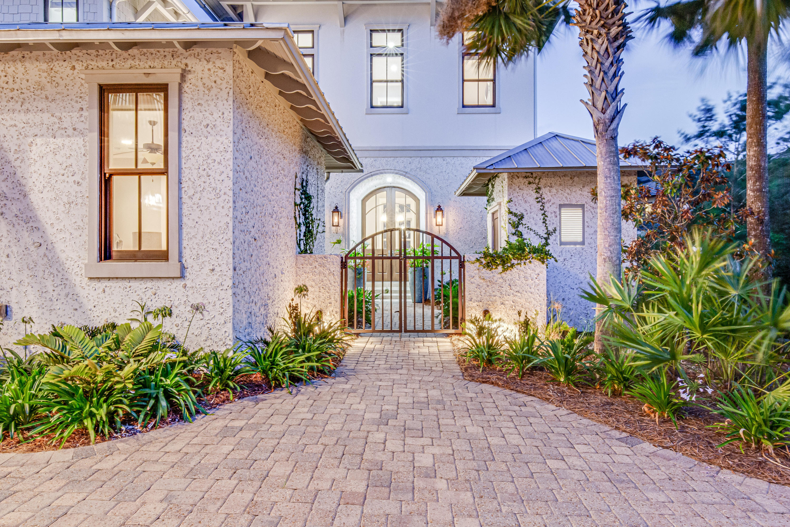 201 West Bermuda Drive Santa Rosa Beach, FL 32459 - Photo 4 of 56 a front view of a house with a garden