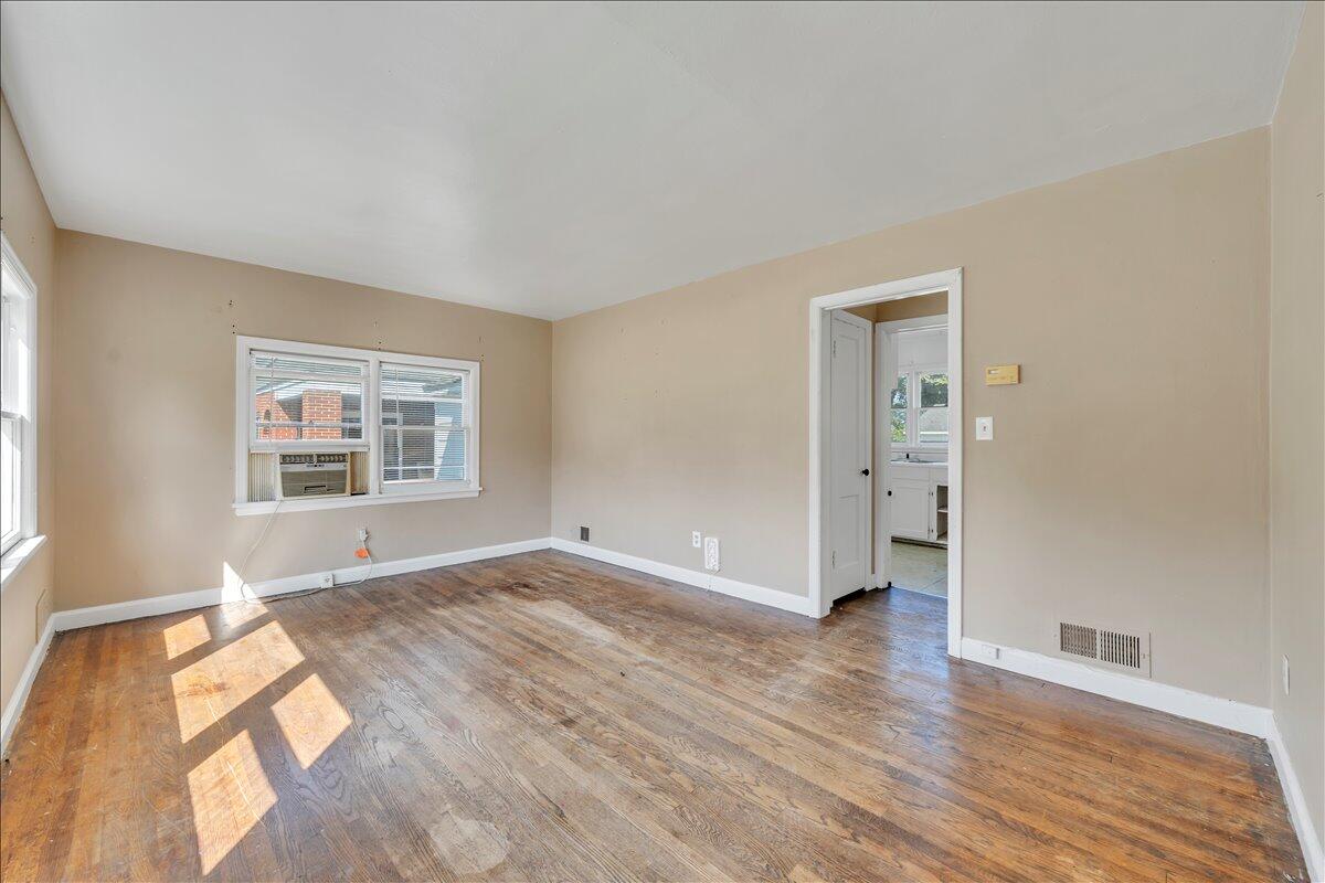 3121 Plantation Road Northeast Roanoke, VA 24012 - Photo 20 of 44 an empty room with wooden floor and windows