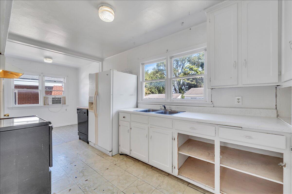 3121 Plantation Road Northeast Roanoke, VA 24012 - Photo 26 of 44 a kitchen with a refrigerator and window