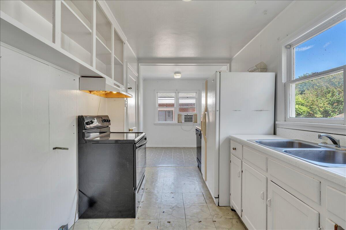 3121 Plantation Road Northeast Roanoke, VA 24012 - Photo 27 of 44 a view of a kitchen with a sink and refrigerator