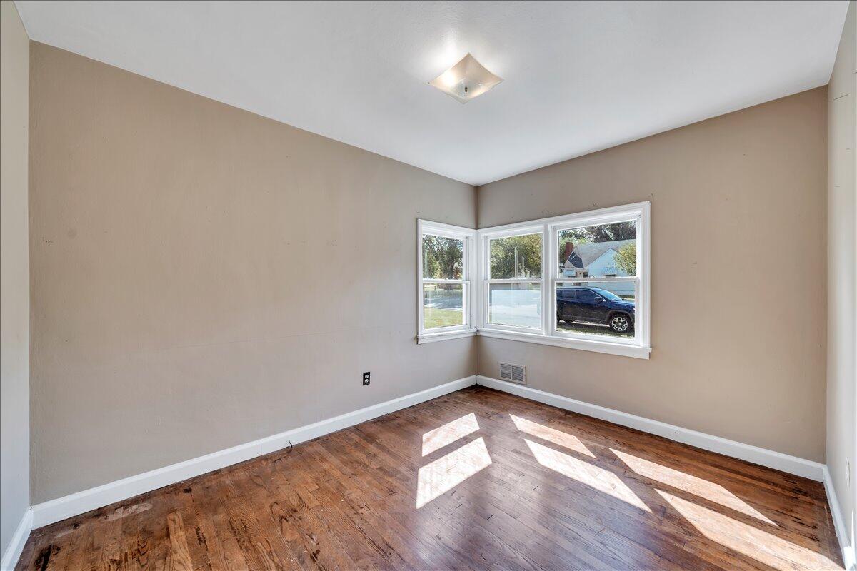 3121 Plantation Road Northeast Roanoke, VA 24012 - Photo 35 of 44 an empty room with wooden floor and windows
