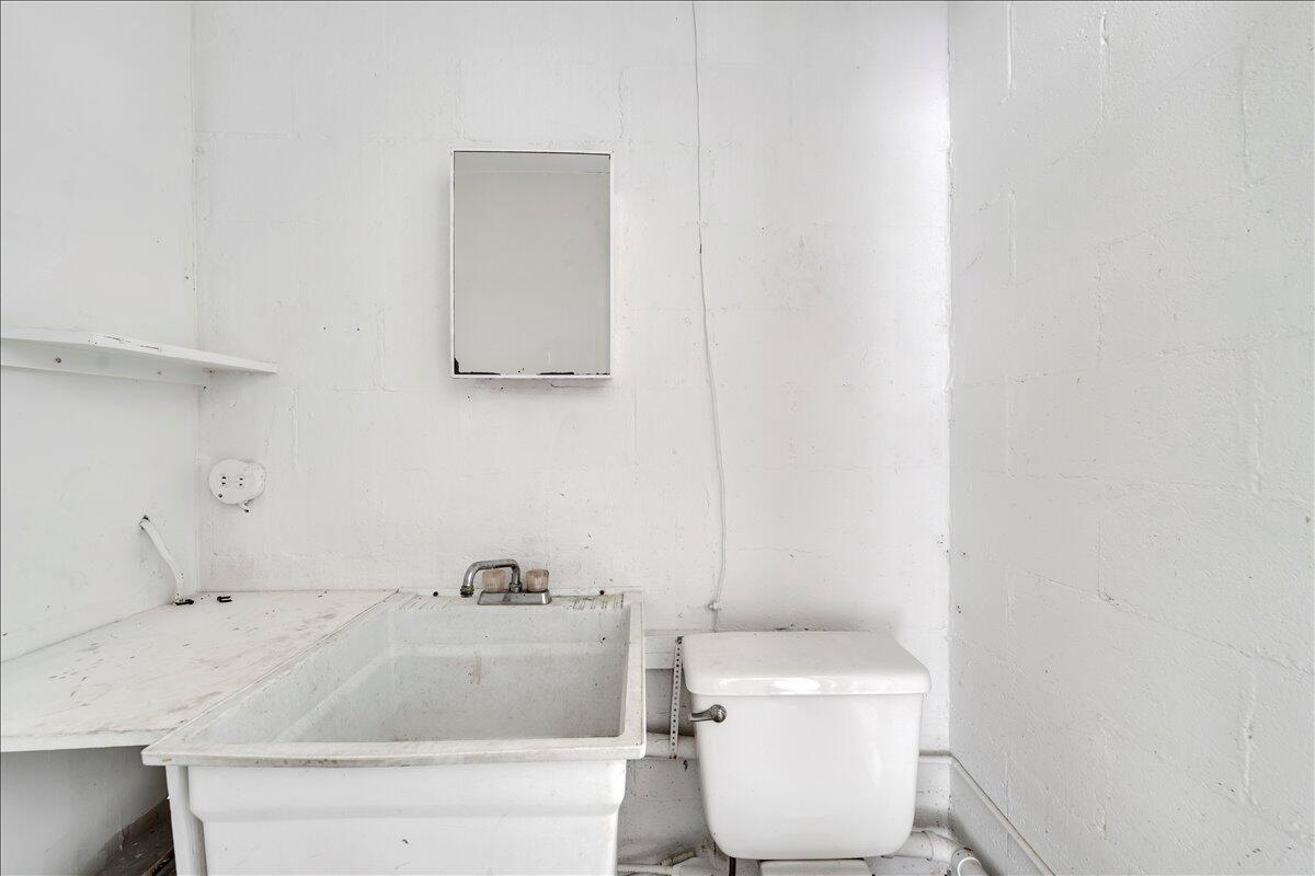3121 Plantation Road Northeast Roanoke, VA 24012 - Photo 10 of 44 a bathroom with a sink and a toilet