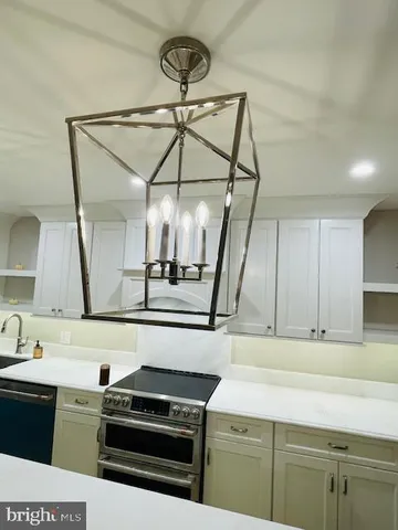 a kitchen with a stove and a sink