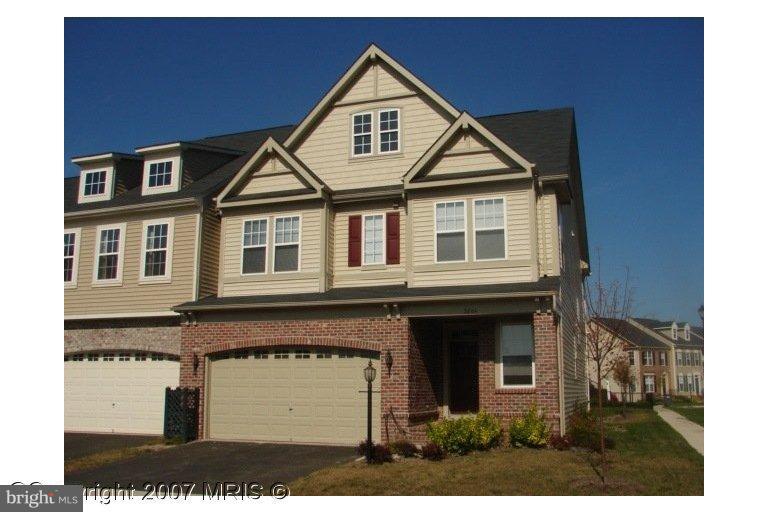 9204 Ribbon Falls Loop Bristow, VA 20136 - Photo 1 of 16 a house view with a garden space