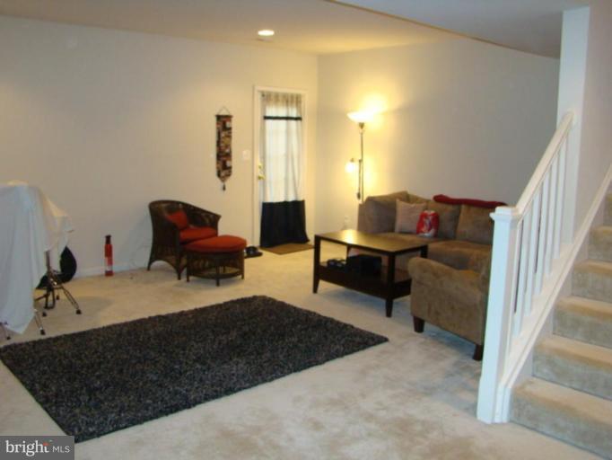 9204 Ribbon Falls Loop Bristow, VA 20136 - Photo 15 of 16 a living room with furniture
