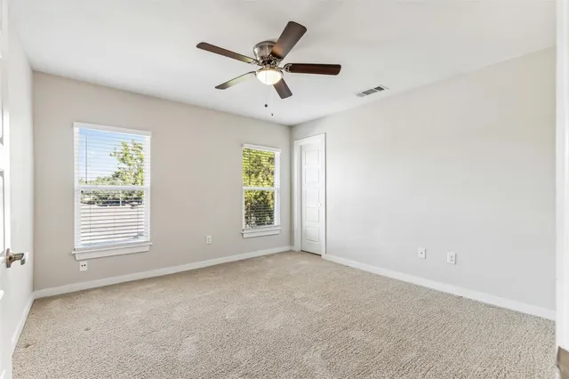 a bathroom with a double vanity sink a mirror and a bathtub