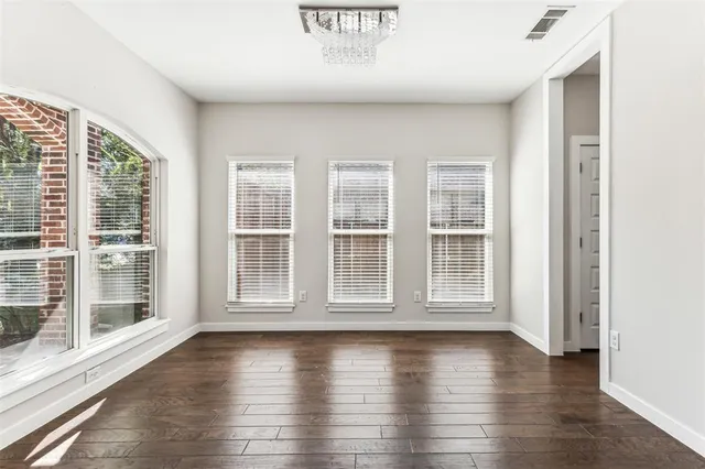 a kitchen with a stove a sink and a microwave
