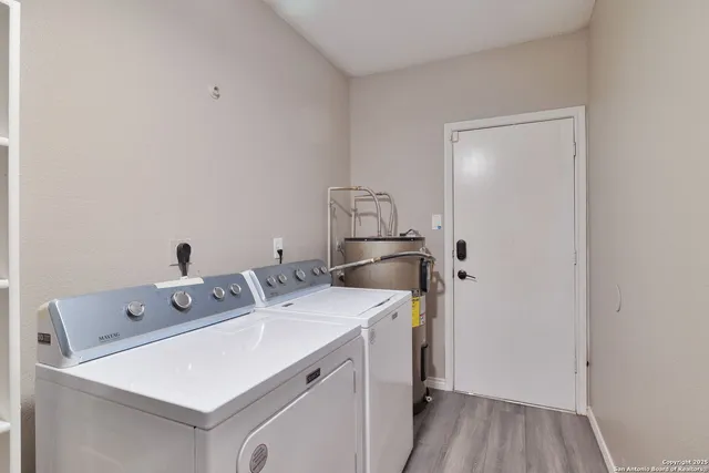 a utility room with dryer and washer