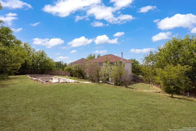 a view of a playground with basketball court