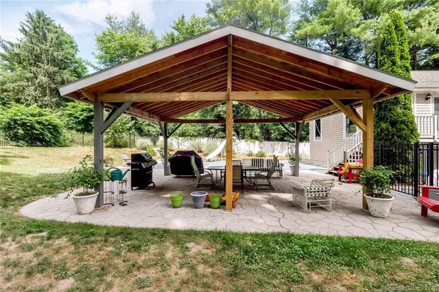 an outdoor space with furniture and umbrella