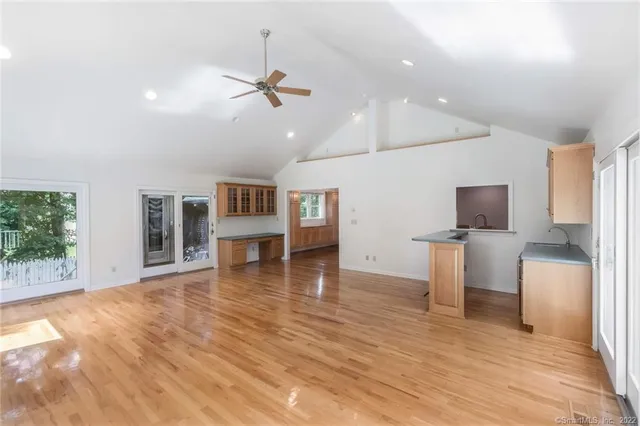 a view of a livingroom with furniture nad wooden floor