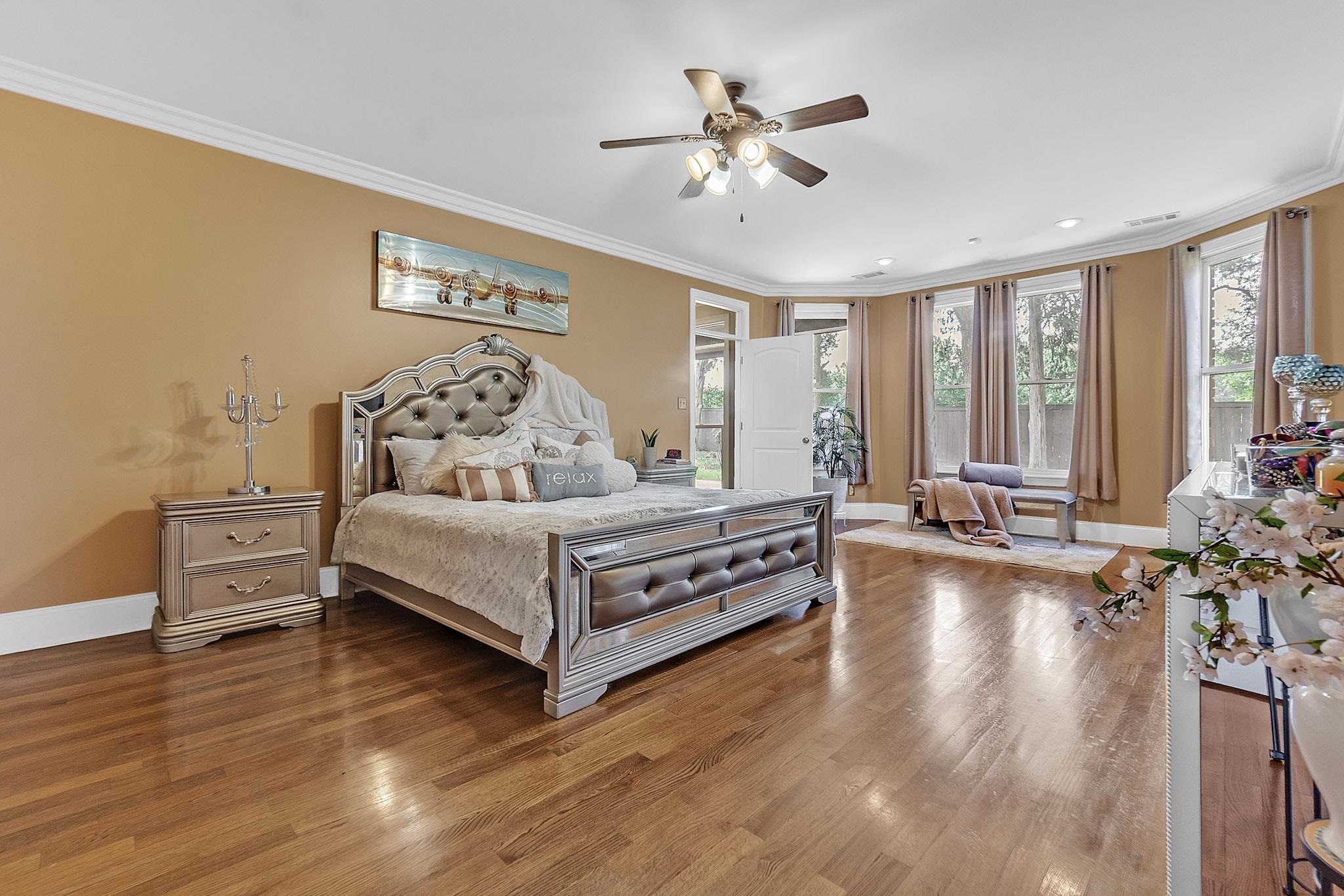 649 Ridge Springs Road Collierville, TN 38017 - Photo 22 of 38 Spacious room featuring wood-finish flooring, a ceiling fan with integrated lighting, and crown molding