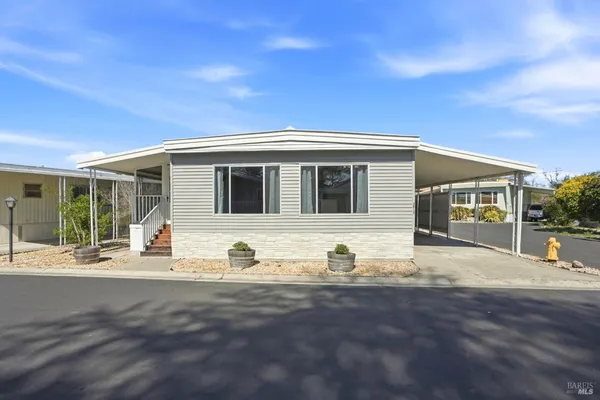 a front view of a house with basket ball court