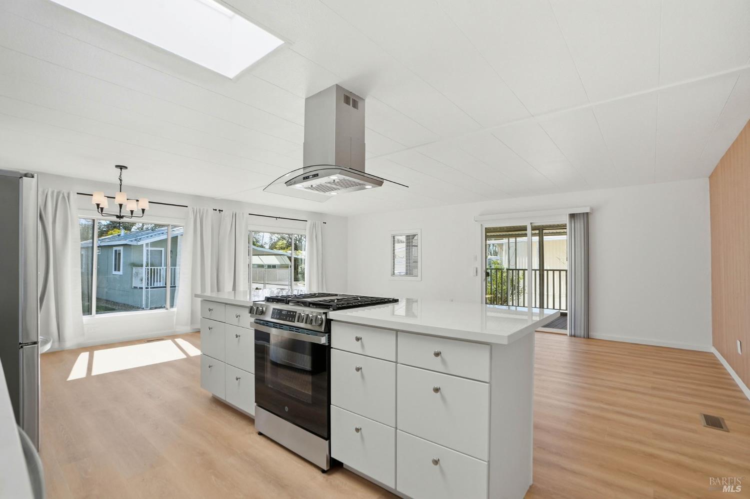 59 Colonial Park Drive Santa Rosa, CA 95403 - Photo 12 of 35 a kitchen with stainless steel appliances granite countertop a stove and a sink
