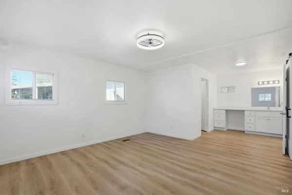 a view of a livingroom with wooden floor