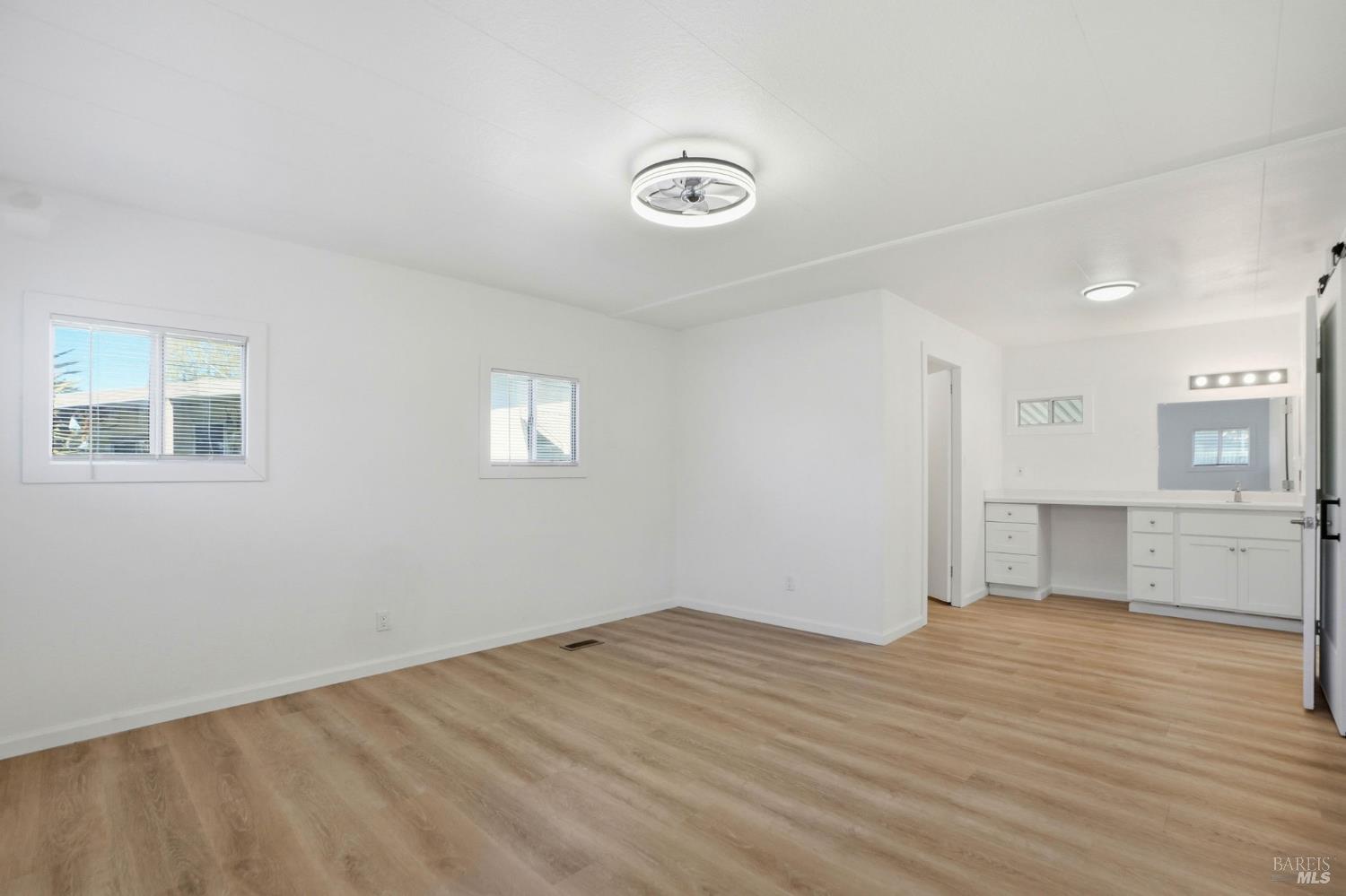 59 Colonial Park Drive Santa Rosa, CA 95403 - Photo 15 of 35 a view of empty room with wooden floor and window