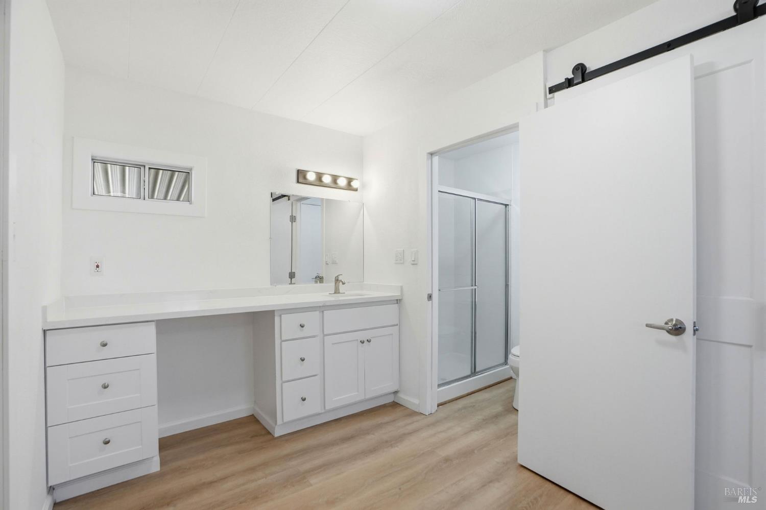 59 Colonial Park Drive Santa Rosa, CA 95403 - Photo 22 of 35 a spacious bathroom with a double vanity sink a mirror and a shower