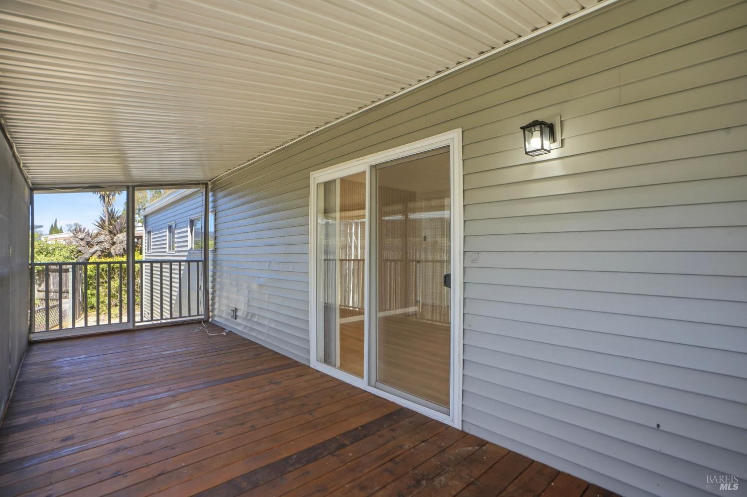 59 Colonial Park Drive Santa Rosa, CA 95403 - Photo 6 of 35 a view of an empty room with wooden floor and a window